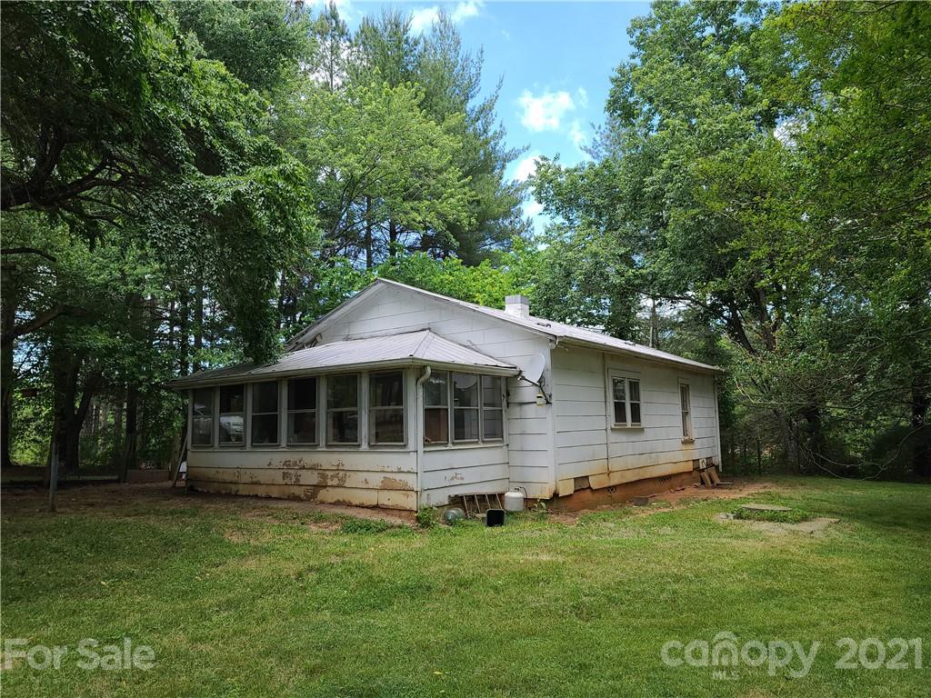 2680 Polk County Line Road Rutherfordton, NC 28139 - Photo 10 of 38 a front view of a house with a garden
