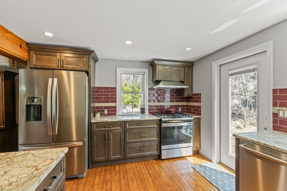8 Trotters Lane Barnstable, MA 02648 - Photo 12 of 41 a kitchen with stainless steel appliances granite countertop a refrigerator stove and sink