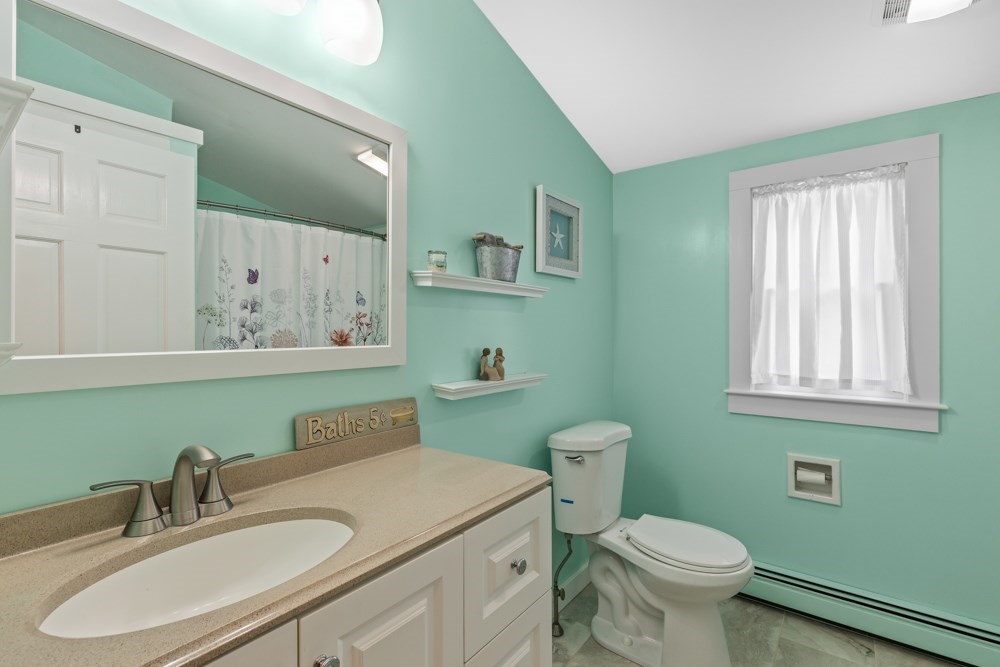 8 Trotters Lane Barnstable, MA 02648 - Photo 17 of 41 a bathroom with a sink toilet and mirror