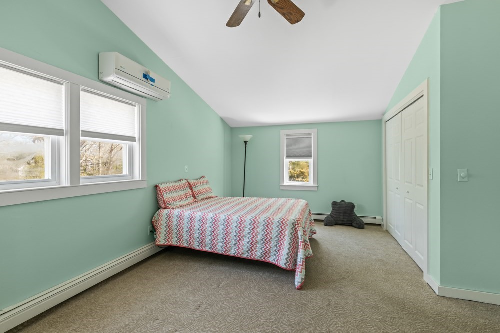 8 Trotters Lane Barnstable, MA 02648 - Photo 18 of 41 a bedroom with a bed and a window