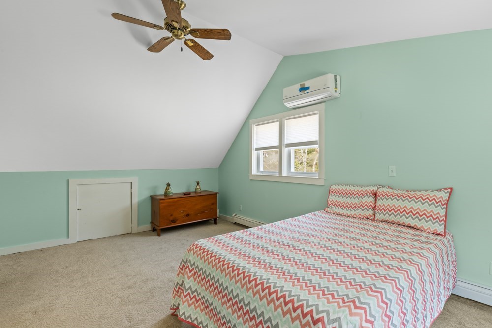 8 Trotters Lane Barnstable, MA 02648 - Photo 19 of 41 a bedroom with a bed and window