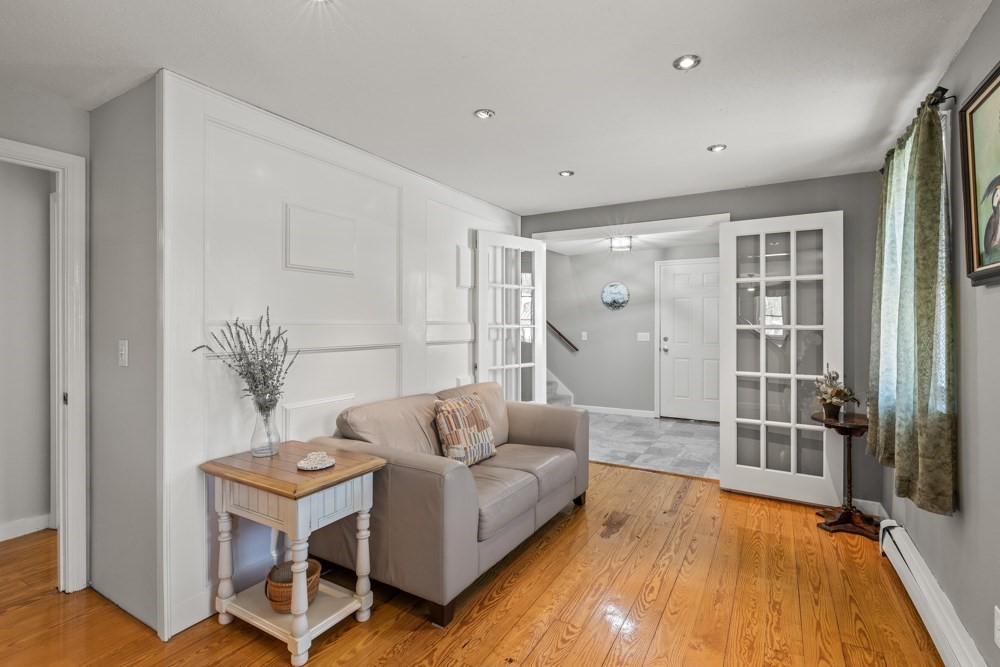 8 Trotters Lane Barnstable, MA 02648 - Photo 2 of 41 a living room with furniture and a potted plant