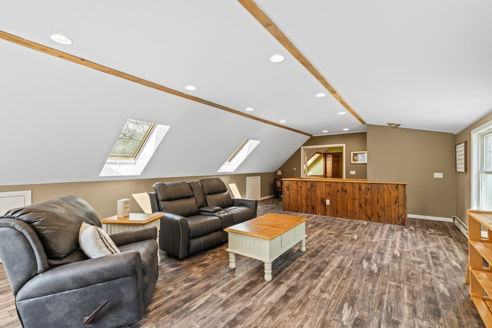 8 Trotters Lane Barnstable, MA 02648 - Photo 23 of 41 a living room with furniture and a wooden floor
