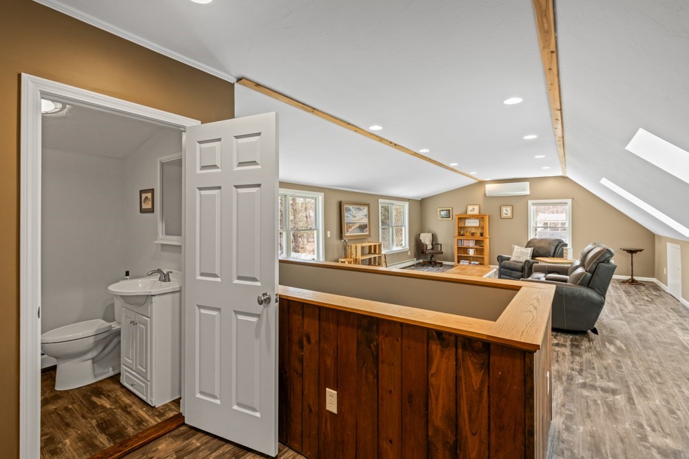8 Trotters Lane Barnstable, MA 02648 - Photo 27 of 41 a living room with furniture a window and wooden floor