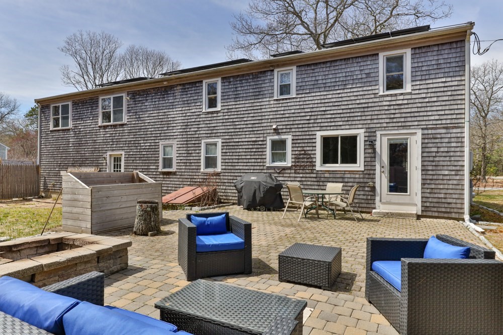 8 Trotters Lane Barnstable, MA 02648 - Photo 29 of 41 a view of a patio with couches chairs and a table