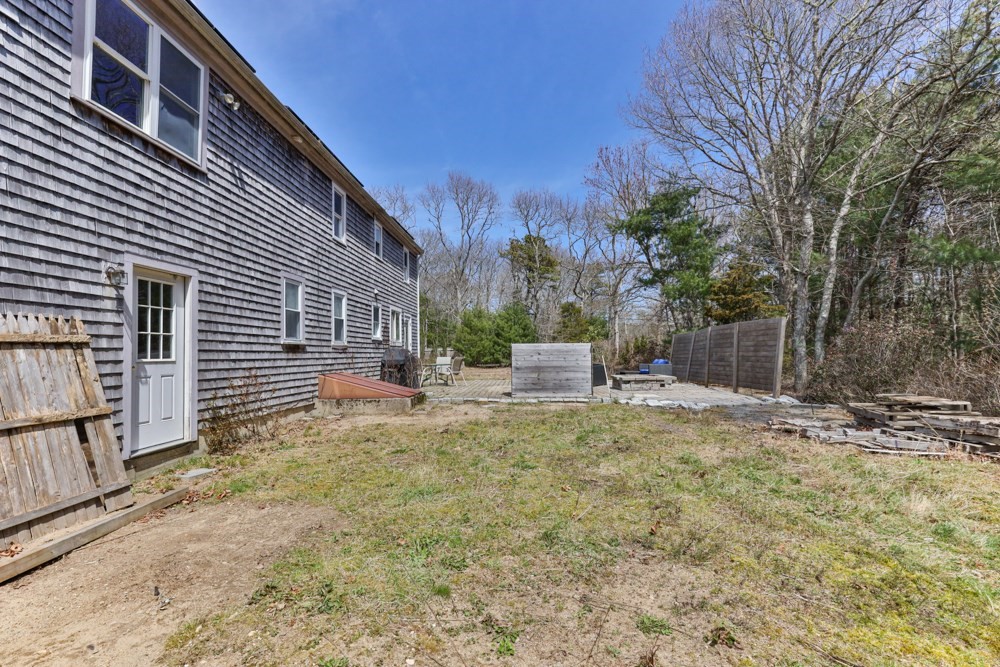 8 Trotters Lane Barnstable, MA 02648 - Photo 32 of 41 a view of a house with backyard and sitting area