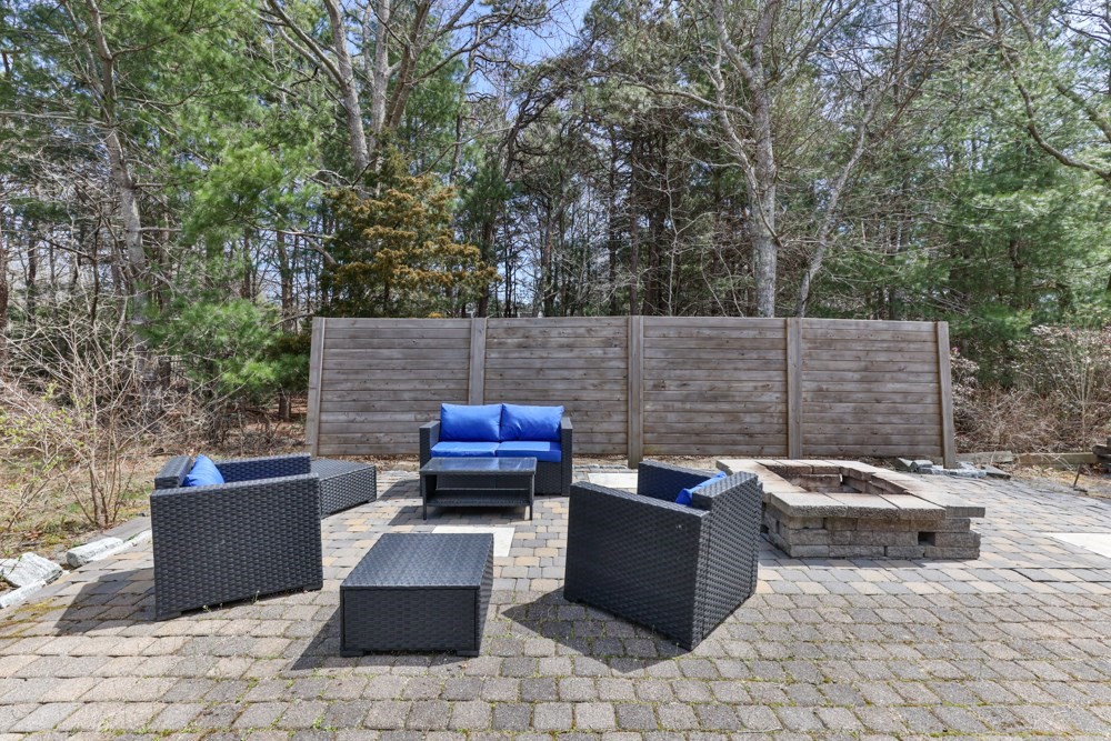8 Trotters Lane Barnstable, MA 02648 - Photo 34 of 41 a view of a patio with table and chairs