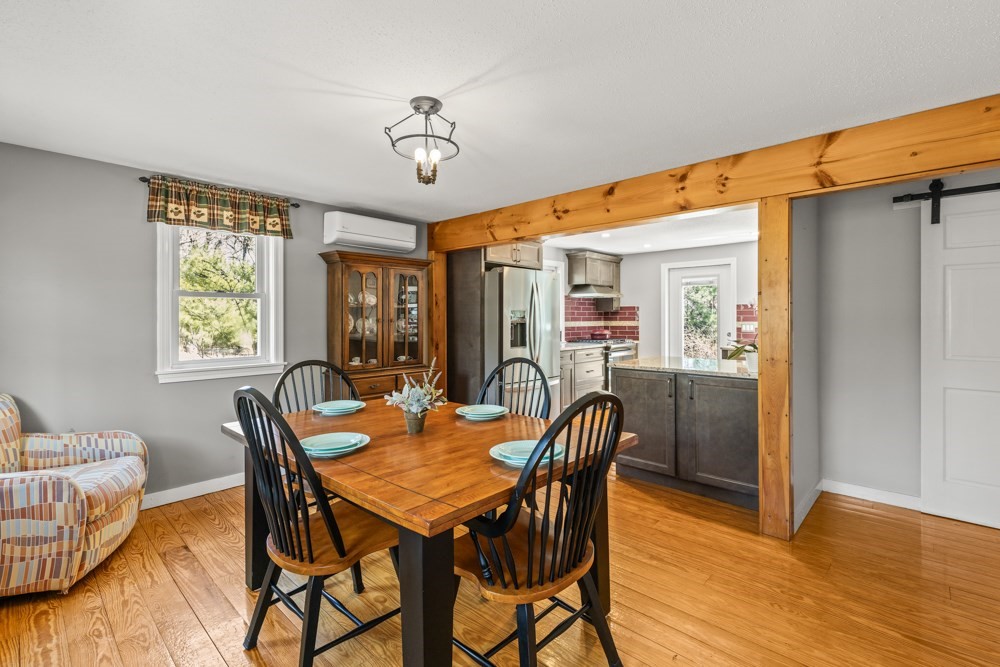 8 Trotters Lane Barnstable, MA 02648 - Photo 7 of 41 a view of a dining room with furniture window and wooden floor