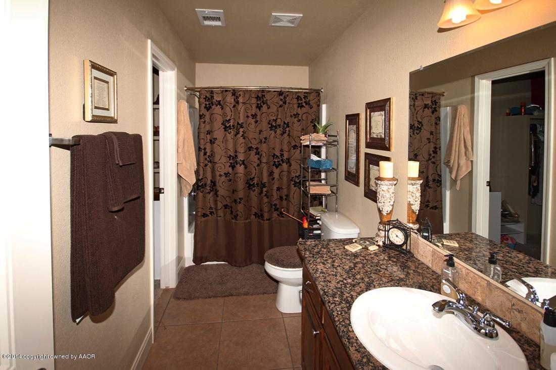 3901 Arden Road Amarillo, TX 79118 - Photo 13 of 24 a bathroom with a sink toilet and shower