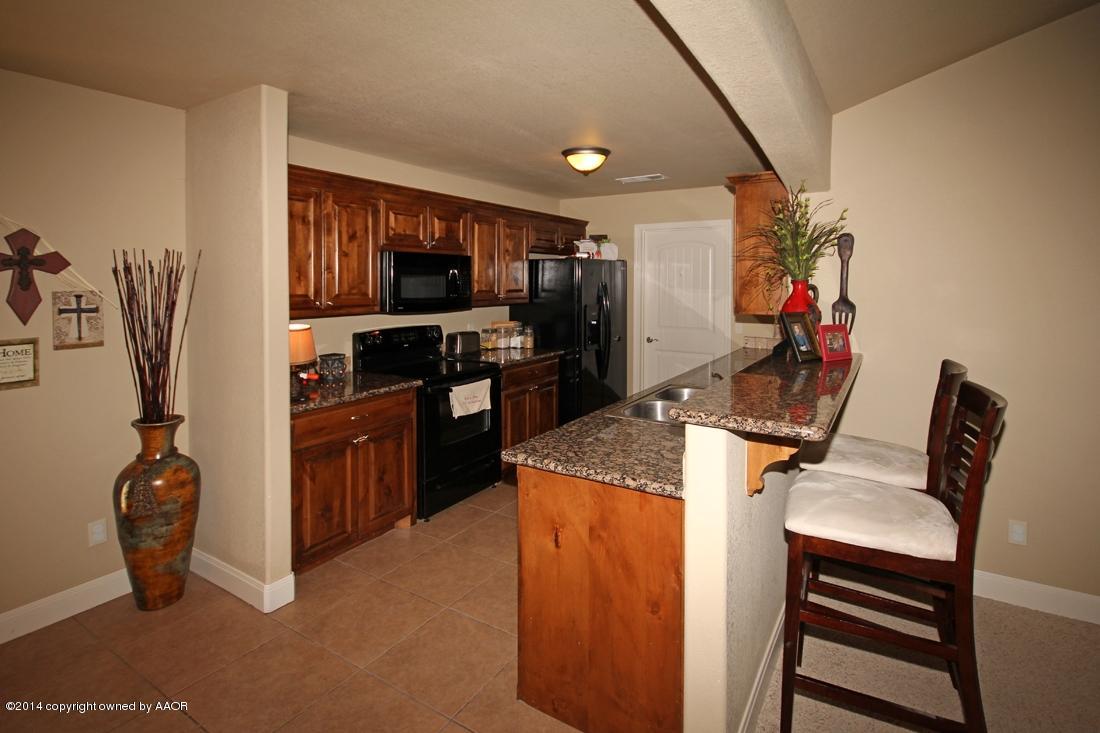 3901 Arden Road Amarillo, TX 79118 - Photo 9 of 24 a view of kitchen with furniture and wooden floor