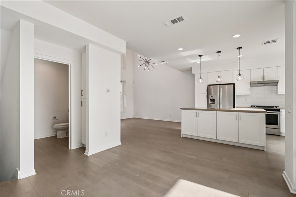 170 Fable Irvine, CA 92618 - Photo 16 of 27 a view of a kitchen with a sink and dishwasher a refrigerator with white cabinets