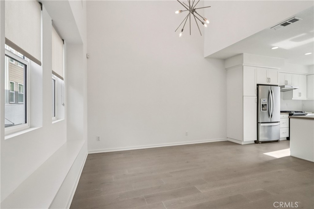 170 Fable Irvine, CA 92618 - Photo 17 of 27 a view of a kitchen with refrigerator and a stove