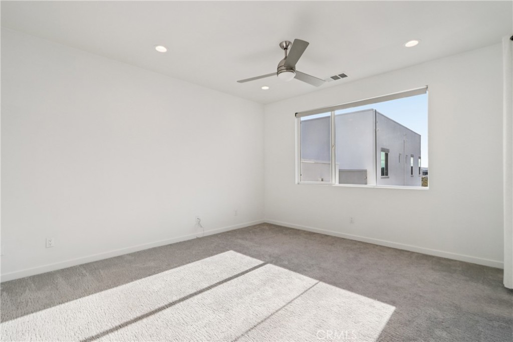 170 Fable Irvine, CA 92618 - Photo 22 of 27 an empty room with windows and fan