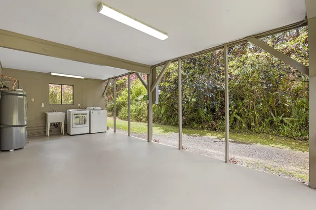 a view of empty room with floor to ceiling window and an outdoor view