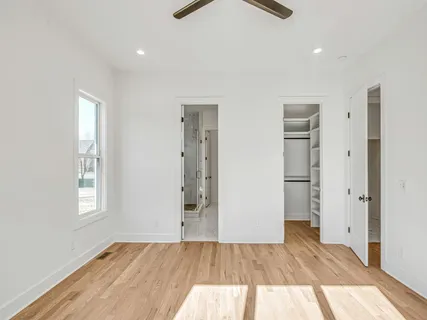 a spacious bathroom with a double vanity sink shower and mirror