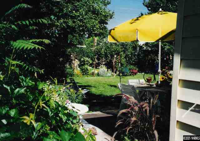 765 Bates Avenue Reno, NV 89502 - Photo 2 of 9 a view of a swimming pool with a patio and a garden