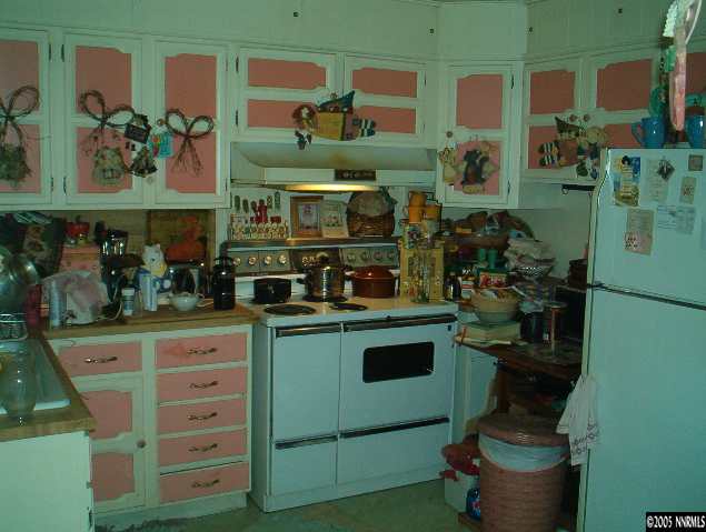 765 Bates Avenue Reno, NV 89502 - Photo 8 of 9 a kitchen with a stove and cabinets