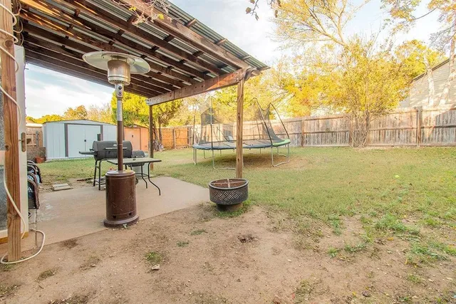 a view of a patio and fire pit