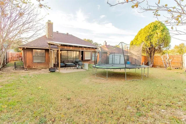 a swimming pool with outdoor seating yard and barbeque oven