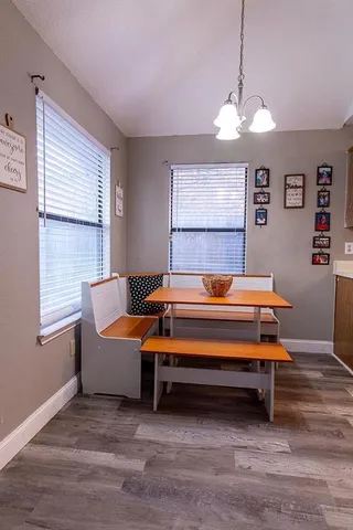 a room with furniture ceiling window and wooden floor