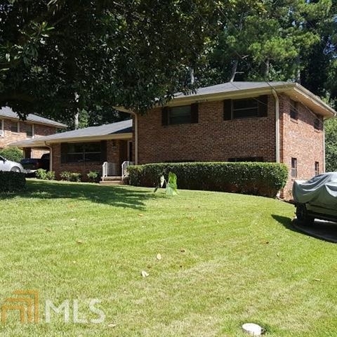 3184 Gay Drive Decatur, GA 30032 - Photo 1 of 18 a front view of a house with garden