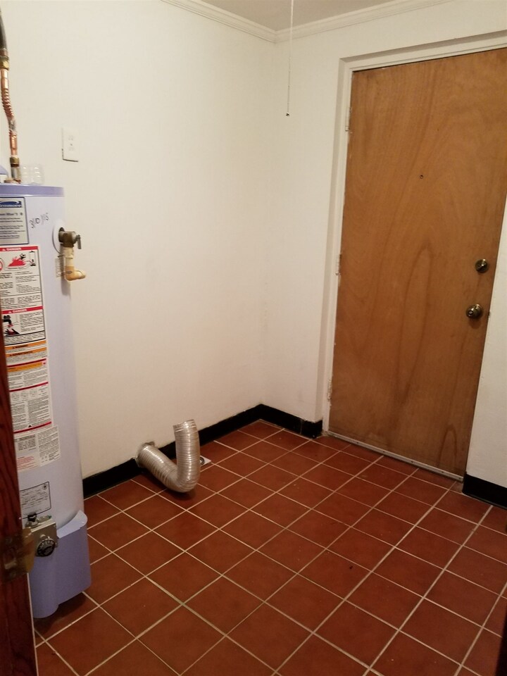 3184 Gay Drive Decatur, GA 30032 - Photo 13 of 18 an empty room with wooden floor and a sink