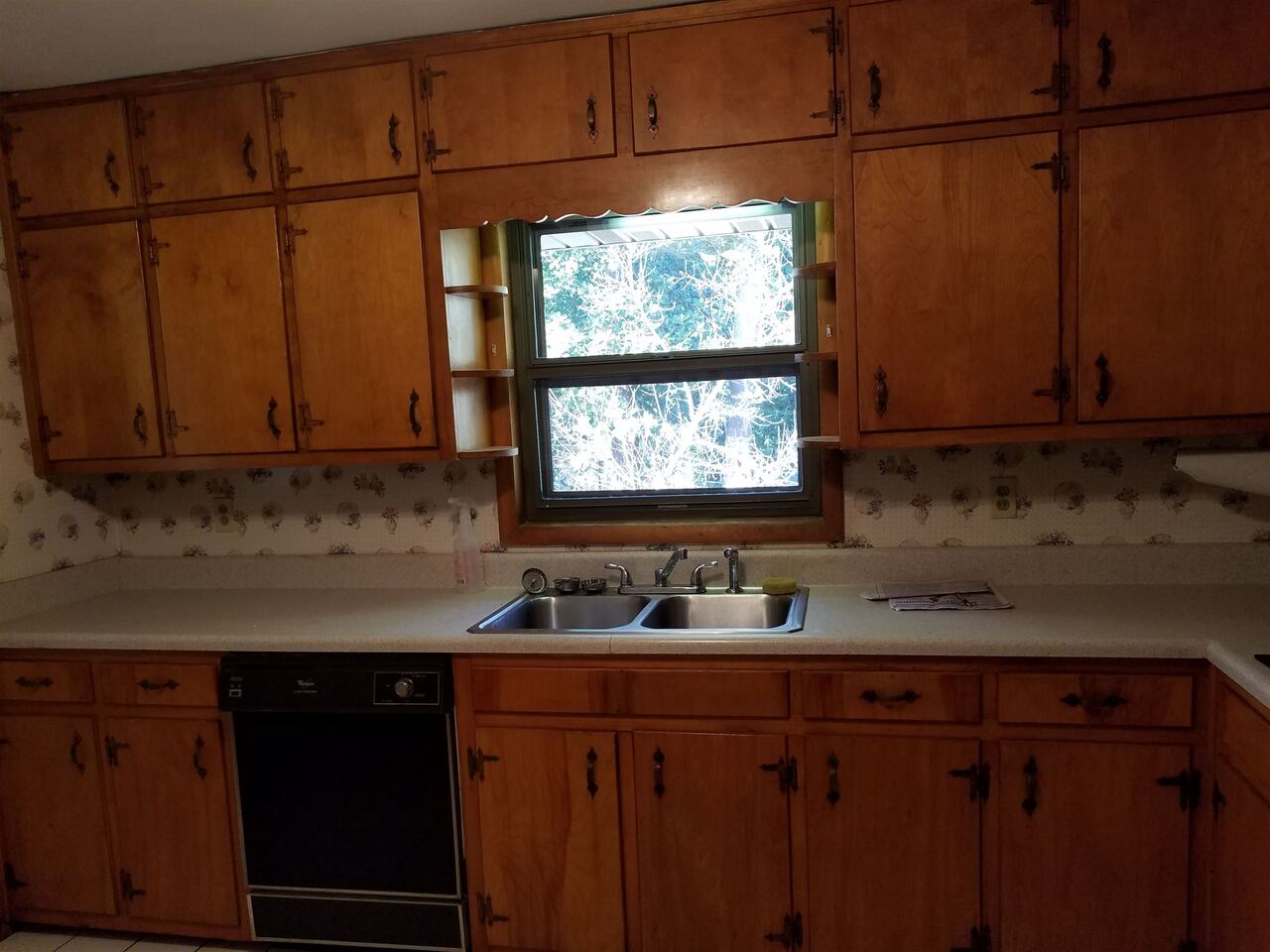 3184 Gay Drive Decatur, GA 30032 - Photo 14 of 18 a kitchen with stainless steel appliances granite countertop wooden cabinets sink and window