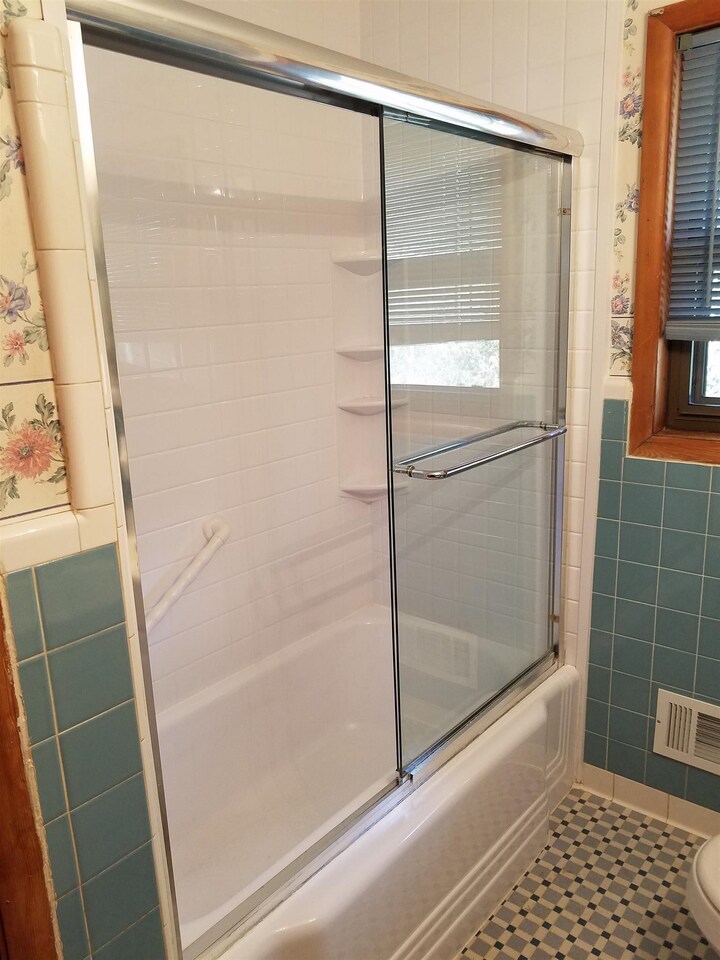 3184 Gay Drive Decatur, GA 30032 - Photo 17 of 18 a bathroom with a glass shower door
