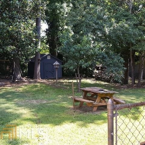 3184 Gay Drive Decatur, GA 30032 - Photo 4 of 18 a backyard of a house with table and chairs