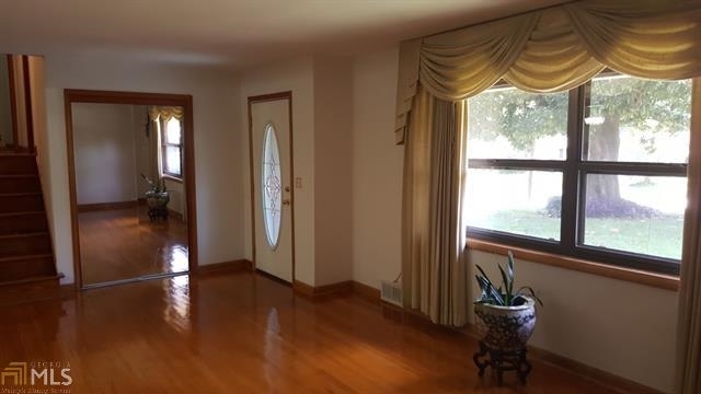 3184 Gay Drive Decatur, GA 30032 - Photo 8 of 18 a view of empty room with wooden floor and fan