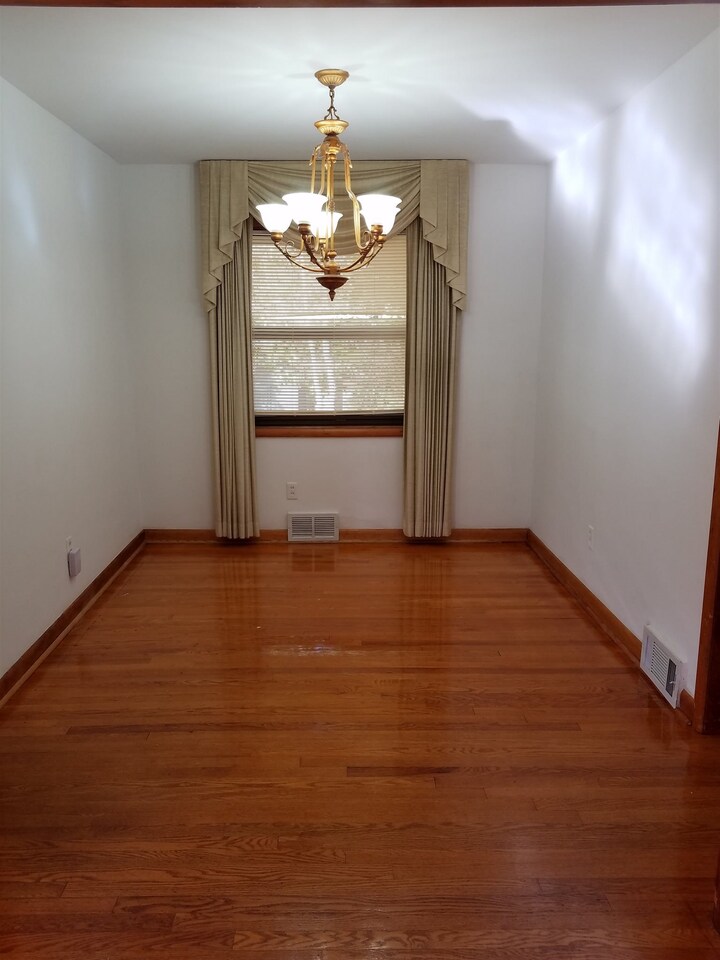 3184 Gay Drive Decatur, GA 30032 - Photo 10 of 18 a view of room with wooden floor chandelier and kitchen view