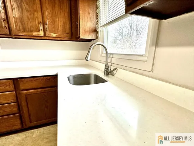 a close view of a sink and a window