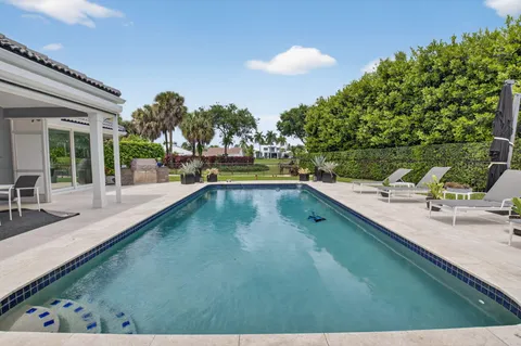 a view of a swimming pool with a patio