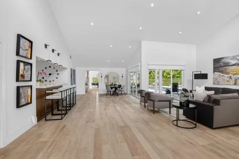 a living room with furniture flat screen tv and a fireplace