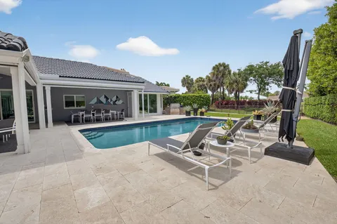 a view of a swimming pool with a lounge chair