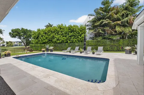 a view of a swimming pool with a patio