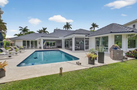a front view of house with yard and outdoor seating