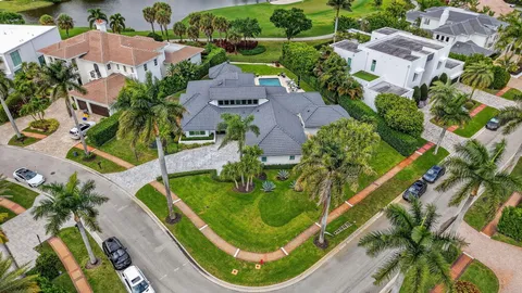 an aerial view of a house with a garden and swimming pool