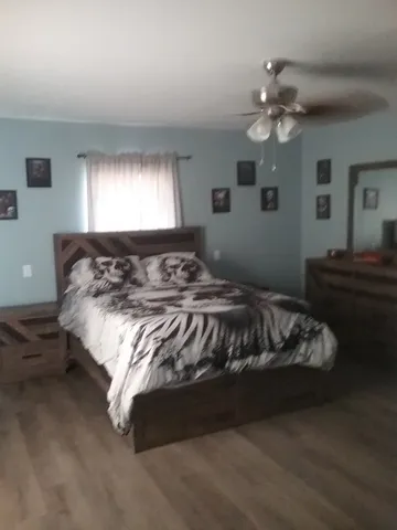a bedroom with a bed and window
