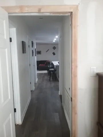 a view of a hallway with living room