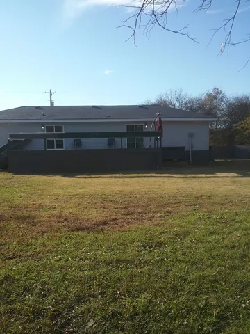 a view of a swimming pool and an outdoor space