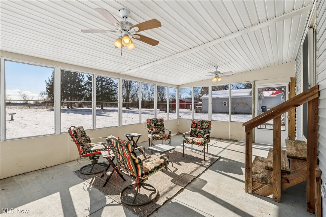 970 Eastern Road Doylestown, OH 44230 - Photo 31 of 49 Sunroom featuring a ceiling fan