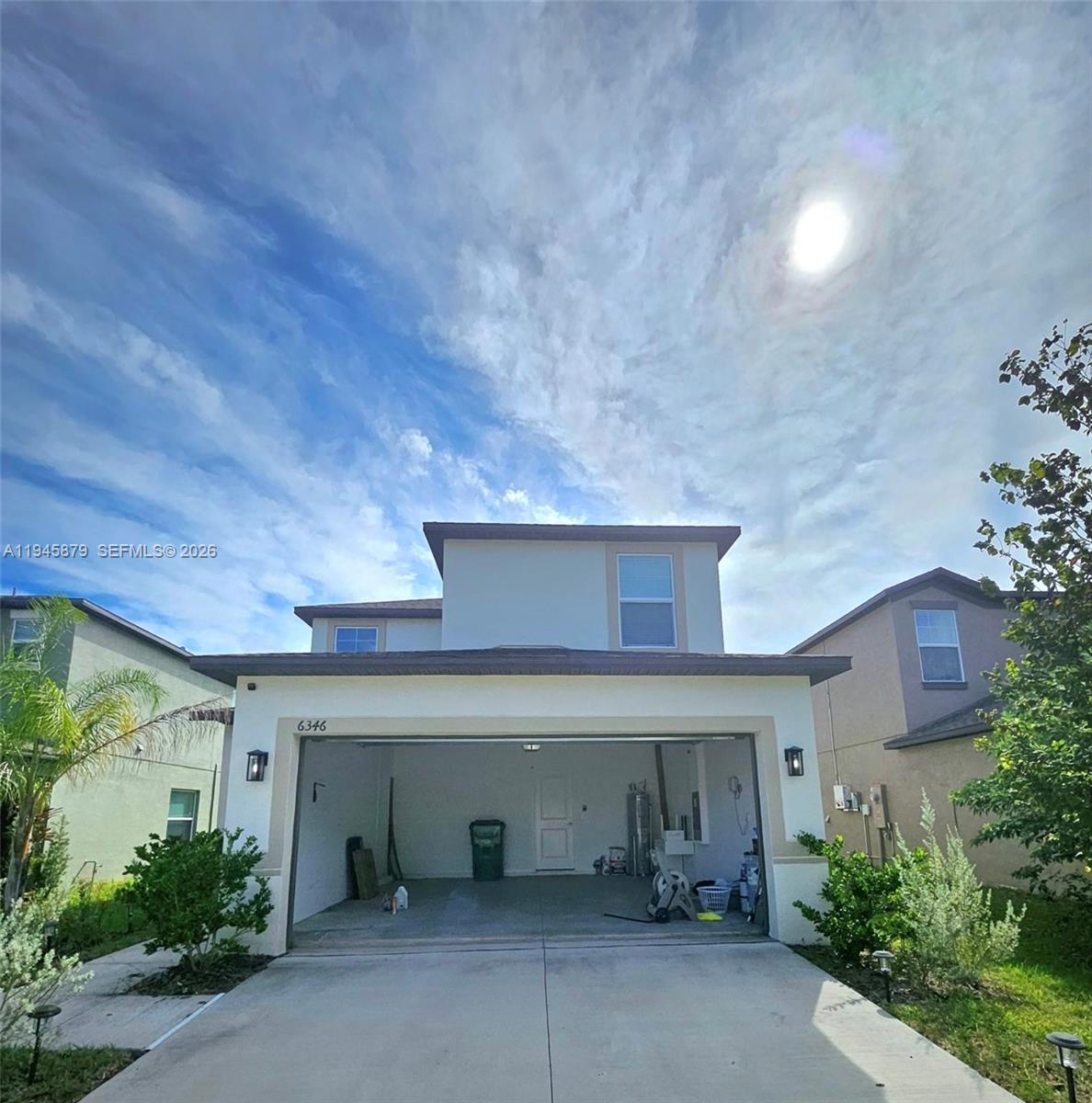 6346 Back Forty Loop, Unit 6346 Zephyrhills, FL 33541 - Photo 6 of 35 front view of a house with yard