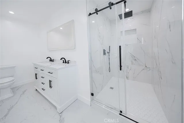 a kitchen with stainless steel appliances granite countertop wooden floors and sink