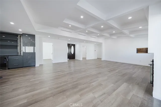wooden floor in an empty room with a fireplace