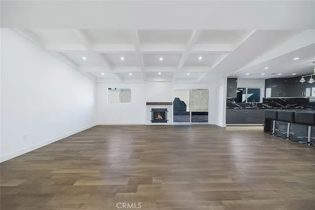 a open kitchen with kitchen island a sink stainless steel appliances and cabinets