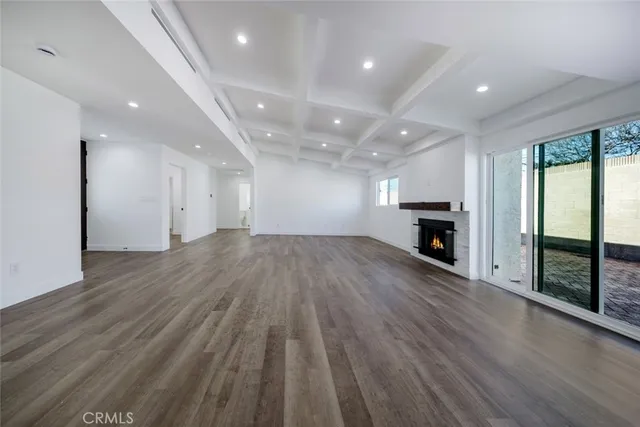 a kitchen with stainless steel appliances granite countertop a refrigerator a sink and a stove