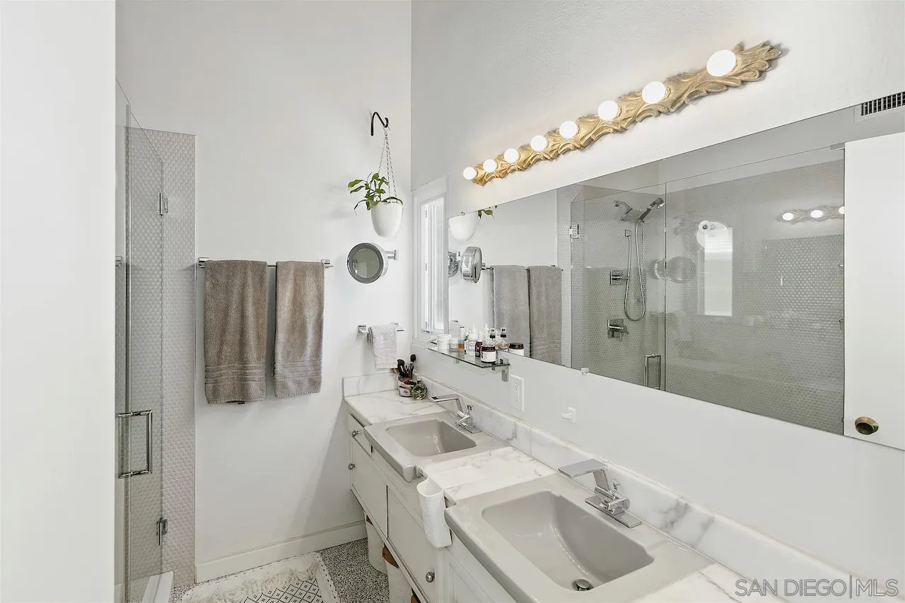 5635 Dartford Way San Diego, CA 92120 - Photo 13 of 26 a bathroom with a sink vanity tub and shower