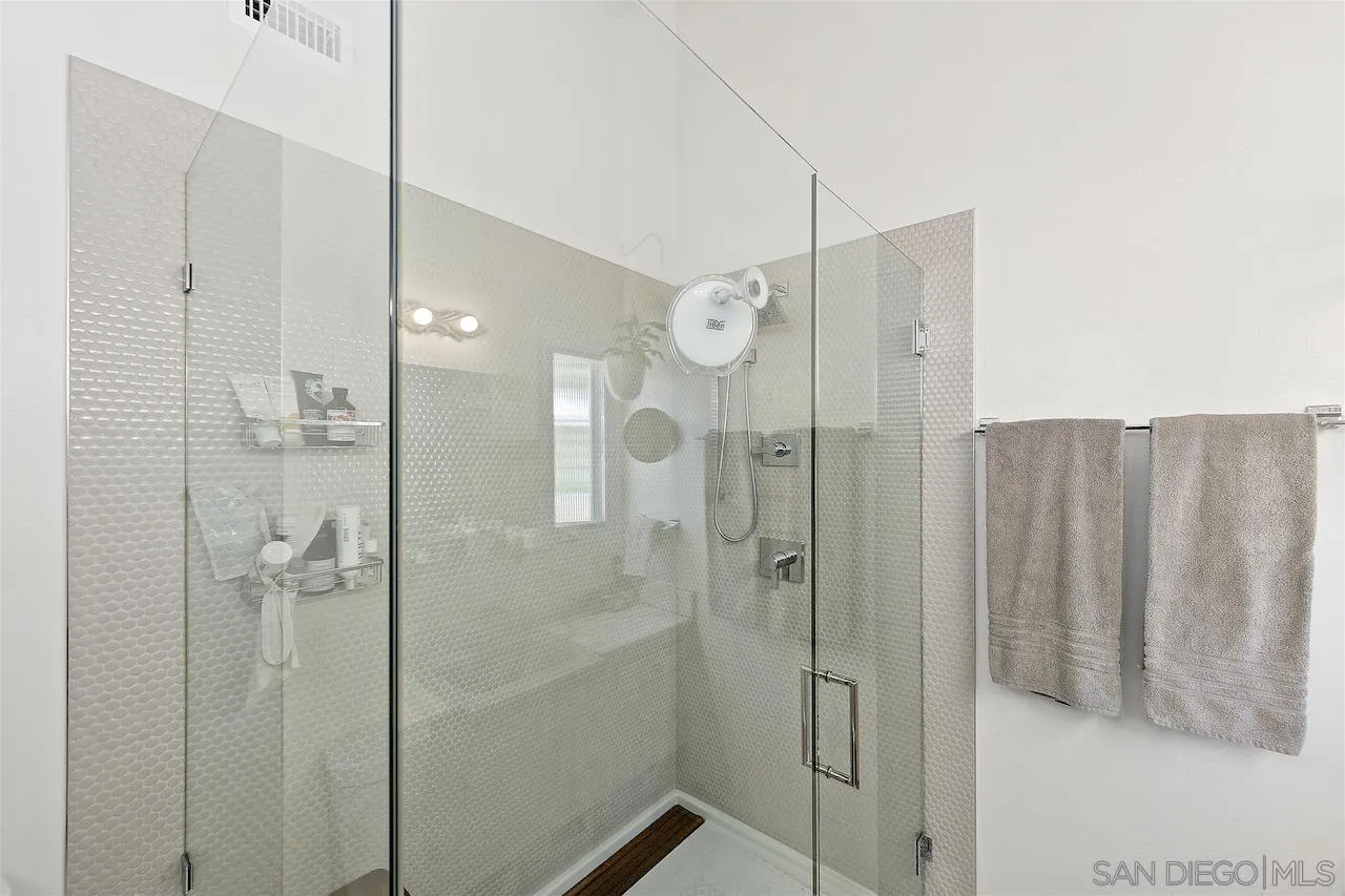 5635 Dartford Way San Diego, CA 92120 - Photo 14 of 26 a bathroom with a shower and a sink