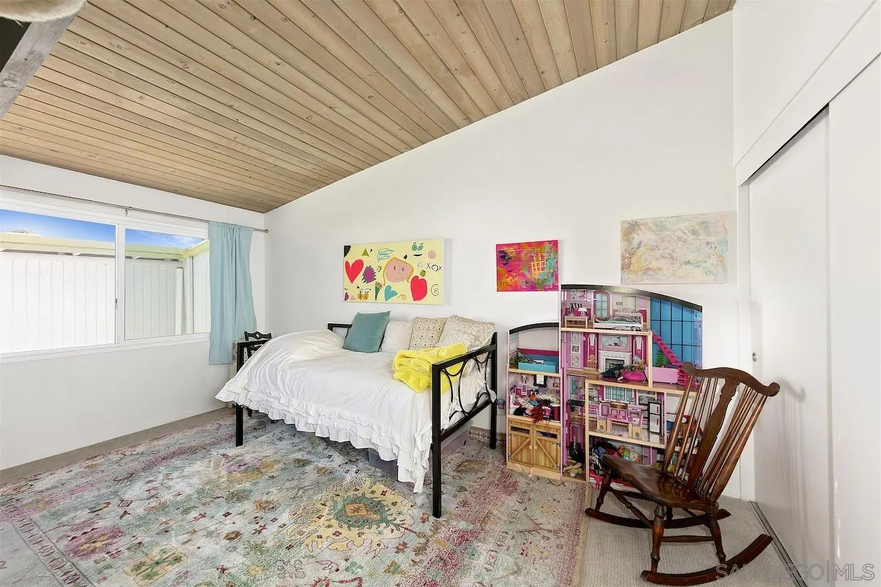 5635 Dartford Way San Diego, CA 92120 - Photo 16 of 26 a bedroom with furniture and a bed